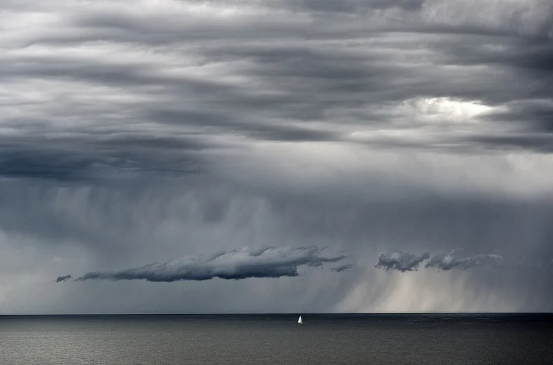 Example of what rain looks like in the distance: grey streaks below clouds. http://foter.com/ff/photo/17355198032/48a517bbc8/, Photo by Tez Goodyer on Foter.com / CC BY-ND